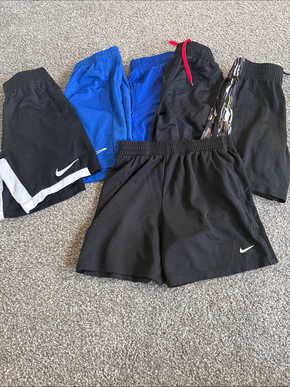 6 pairs boys athletic shorts size mediums. Nike and Russell